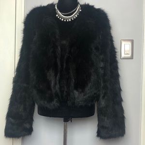 Black, warm, faux-fur coat to top off your holiday cocktail/party outfit.